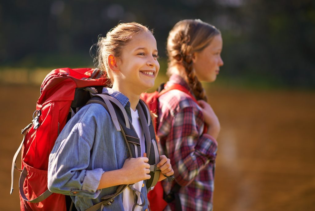Carefree,In,Nature.,Shot,Of,Two,Young,Girls,Wearing,Backpacks